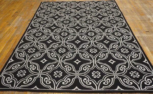 Contemporary handwoven wool needlepoint rug — black geometric pattern - detail view 1