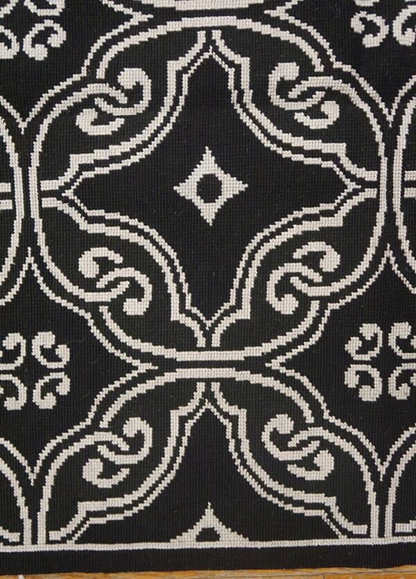 Contemporary handwoven wool needlepoint rug — black geometric pattern - detail view 3