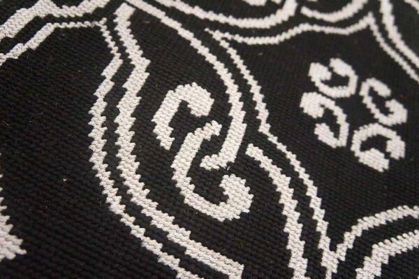 Contemporary handwoven wool needlepoint rug — black geometric pattern - detail view 6