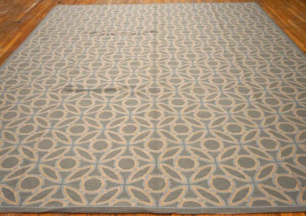 Contemporary handwoven wool needlepoint rug — blue & orange circles geometric - detail view 1