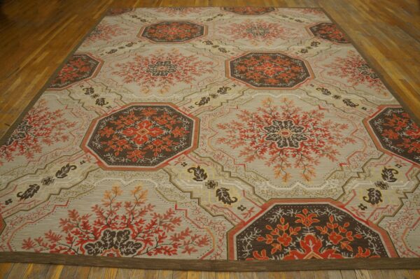 Contemporary handwoven wool needlepoint rug â€” floral-medallion composition - detail view 1