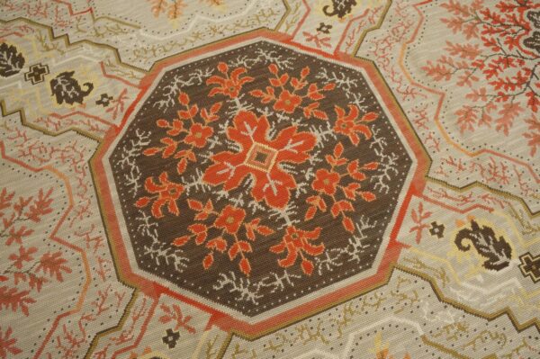 Contemporary handwoven wool needlepoint rug â€” floral-medallion composition - detail view 2