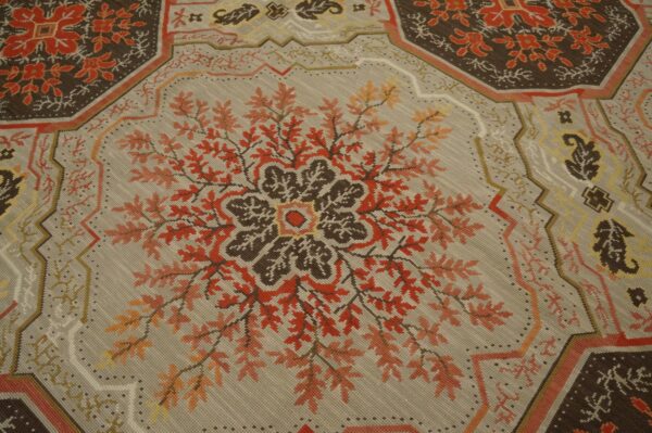 Contemporary handwoven wool needlepoint rug â€” floral-medallion composition - detail view 3