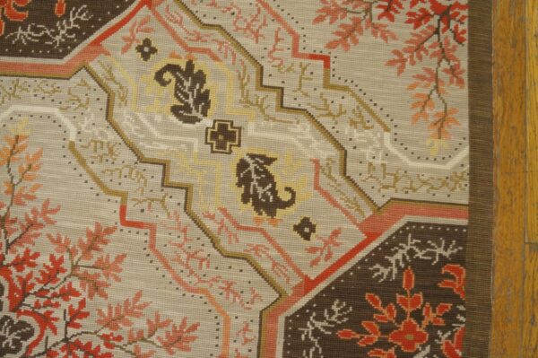 Contemporary handwoven wool needlepoint rug â€” floral-medallion composition - detail view 4