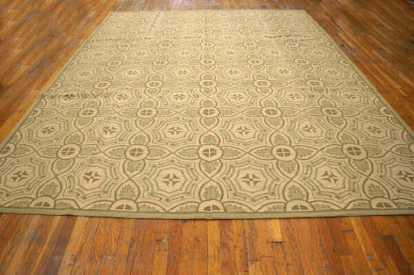 Contemporary handwoven wool needlepoint rug — four-star motif - detail view 1