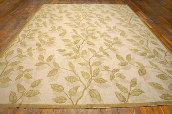 Contemporary handwoven wool needlepoint rug â€” ivory ground, floral composition - detail view 1