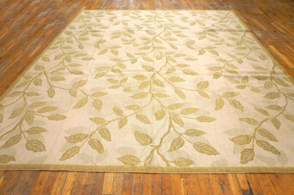 Contemporary handwoven wool needlepoint rug â€” ivory ground, glamorous branches - detail view 1