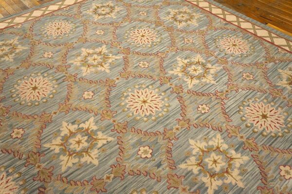 Contemporary handwoven wool needlepoint rug â€” light blue color - detail view 10