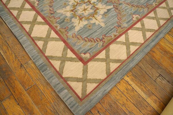 Contemporary handwoven wool needlepoint rug â€” light blue color - detail view 11