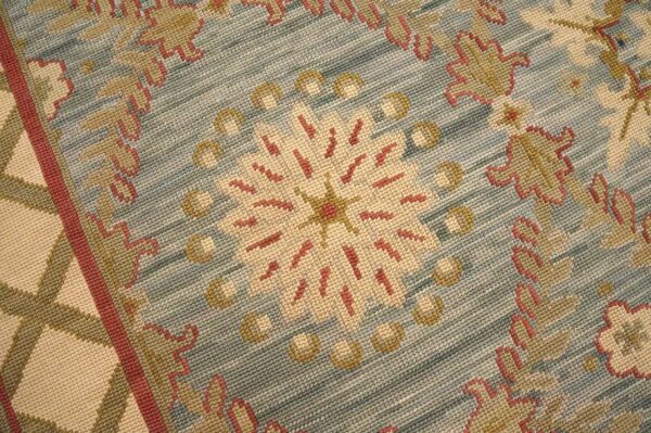 Contemporary handwoven wool needlepoint rug â€” light blue color - detail view 2