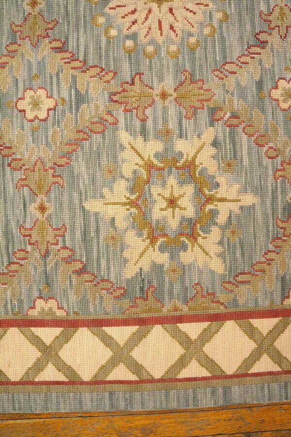 Contemporary handwoven wool needlepoint rug â€” light blue color - detail view 3