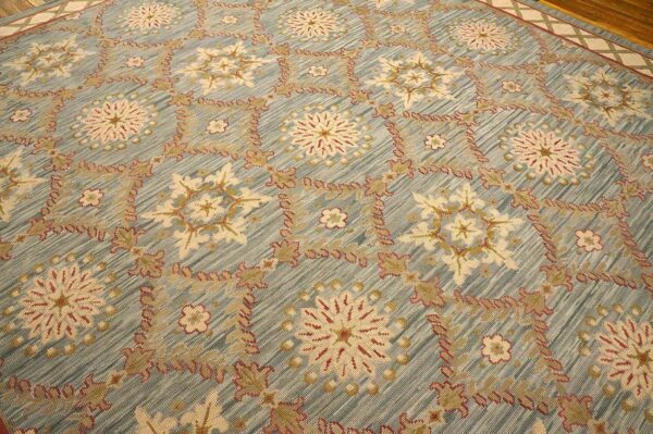 Contemporary handwoven wool needlepoint rug â€” light blue color - detail view 5