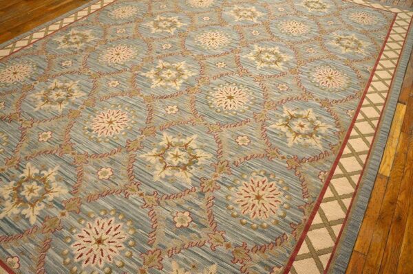 Contemporary handwoven wool needlepoint rug â€” light blue color - detail view 7
