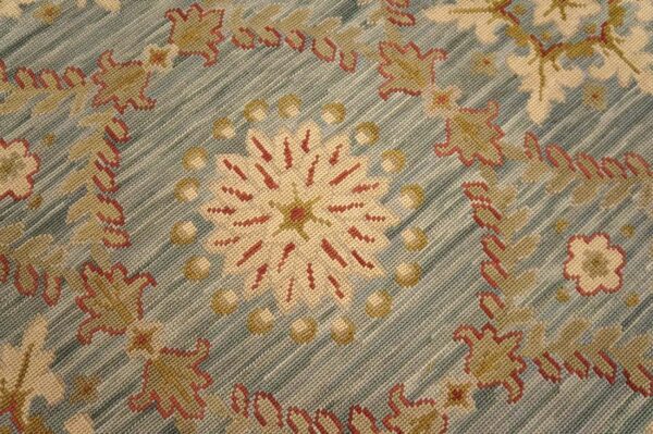 Contemporary handwoven wool needlepoint rug â€” light blue color - detail view 8