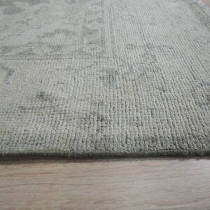 Textured rug with folded edge