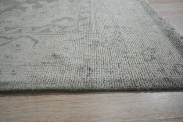 Textured rug with folded edge