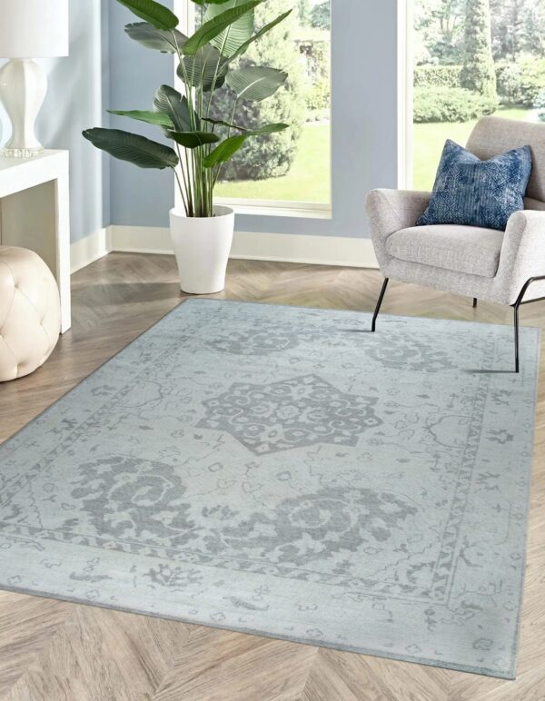 Elegant rug on wooden floor