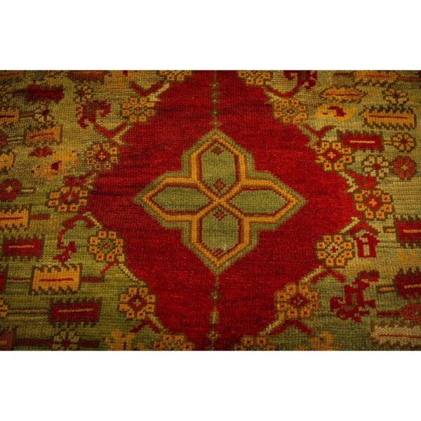 1890s red field medallion knotted wool antique oushak turkish decorative rug - detail view 2