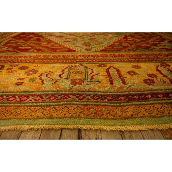 1890s red field medallion knotted wool antique oushak turkish decorative rug - detail view 3