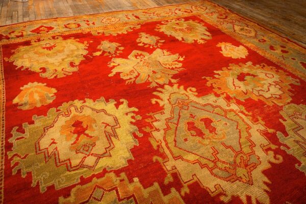 1890s red ground geometric knotted wool antique oushak turkish decorative rug 3 1890s red ground geometric knotted wool antique oushak turkish decorative rug - detail view 2