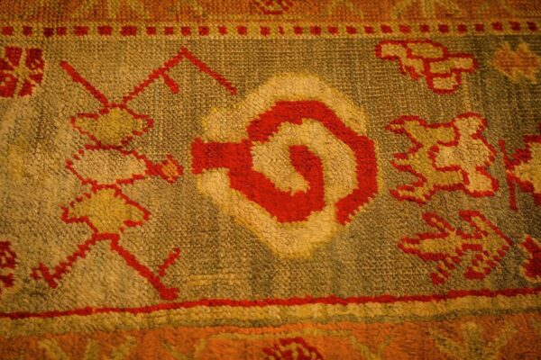 1890s red ground geometric knotted wool antique oushak turkish decorative rug 5 1890s red ground geometric knotted wool antique oushak turkish decorative rug - detail view 4