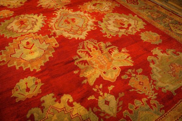 1890s red ground geometric knotted wool antique oushak turkish decorative rug 6 1890s red ground geometric knotted wool antique oushak turkish decorative rug - detail view 5