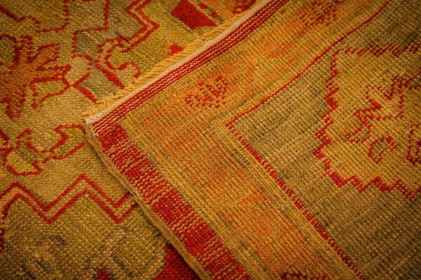 1890s red ground geometric knotted wool antique oushak turkish decorative rug 8 1890s red ground geometric knotted wool antique oushak turkish decorative rug - detail view 7