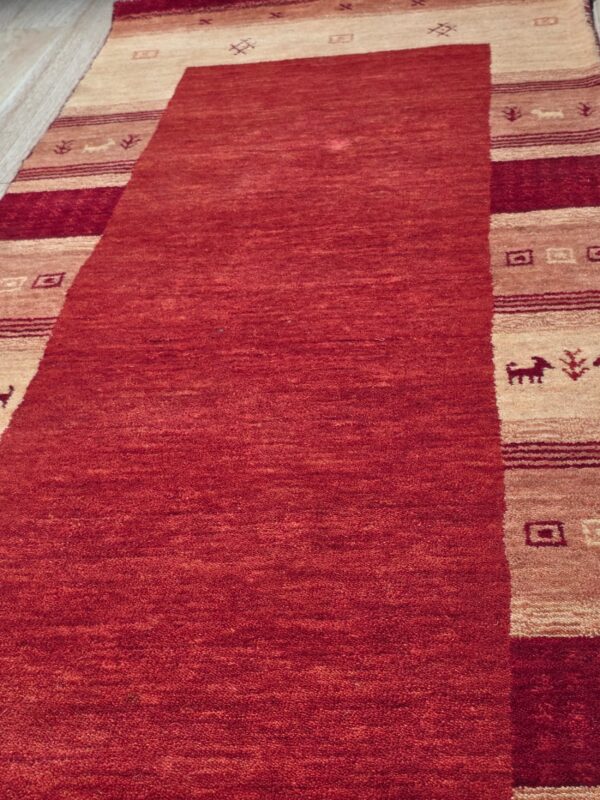 Handloomed red gabbeh tribal wool area rug - image 4