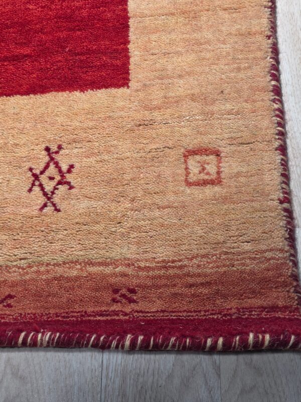 Handloomed red gabbeh tribal wool area rug - image 5
