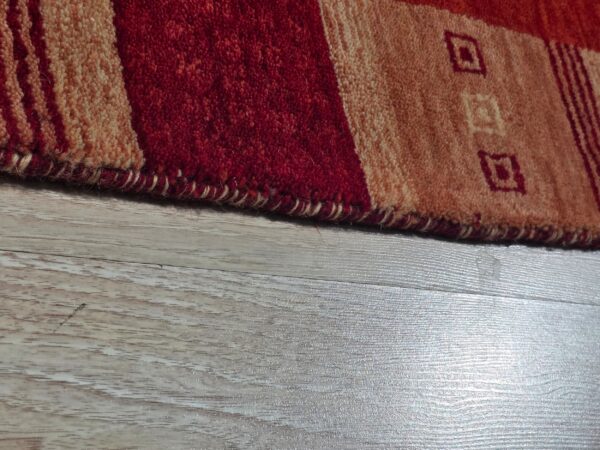Handloomed red gabbeh tribal wool area rug - image 8