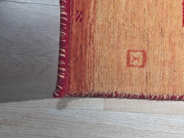 Handloomed red gabbeh tribal wool area rug - image 9