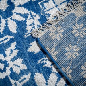 Blue ivory Oushak rug back corner detail