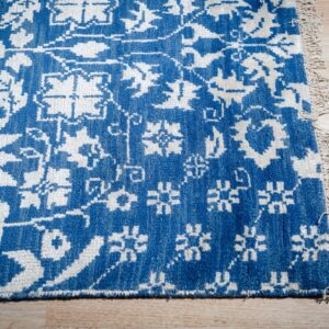 Blue ivory Oushak rug corner and fringe detail