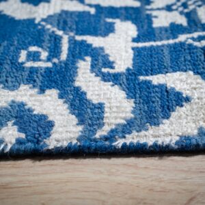 Blue ivory Oushak rug floral motif close-up