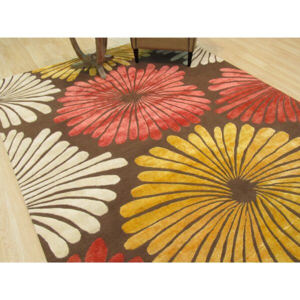 Brown transitional floral rug styled in a living room