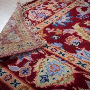 Burgundy Oushak rug back and border detail