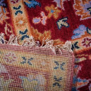 Burgundy Oushak rug hand-knotted back and fringe detail