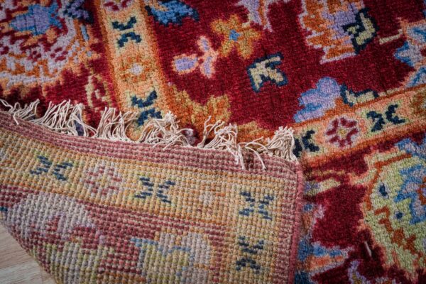 Burgundy oushak rug hand-knotted back and fringe detail