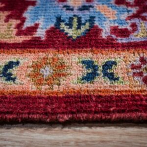 Burgundy Oushak rug border close-up