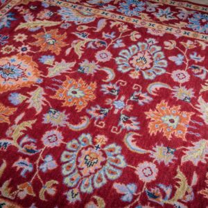 Burgundy Oushak rug angled field detail
