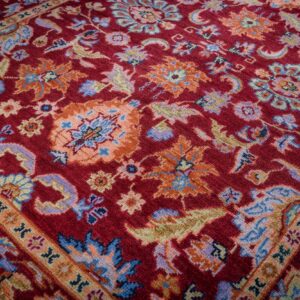 Burgundy Oushak rug field detail with floral palmettes
