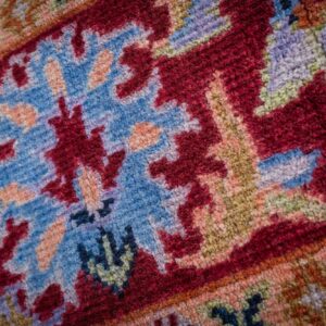 Burgundy Oushak rug floral palmette motif close-up