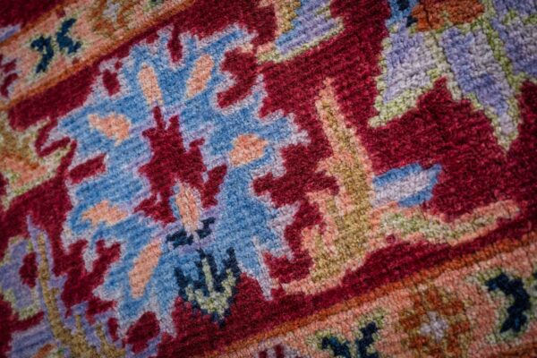 Burgundy oushak rug floral palmette motif close-up
