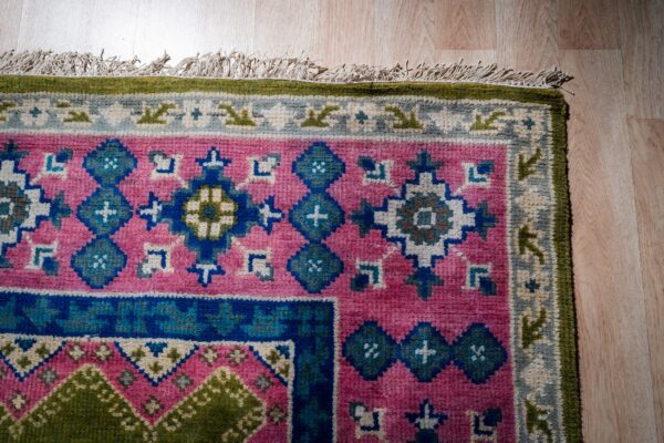 Ava kazak light green hand knotted wool rug 11 Green and fuchsia kazak rug corner detail