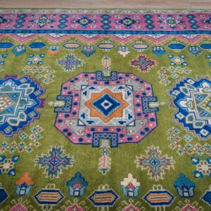 Green and fuchsia Kazak rug top-down three-medallion detail