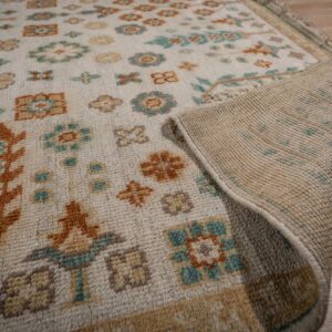 Ivory Oushak rug field and hand-knotted back detail