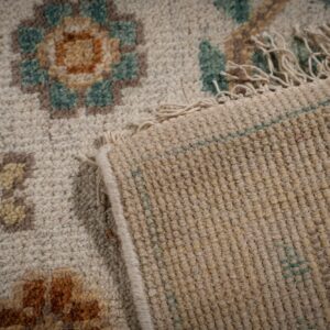 Ivory Oushak rug back and fringe detail
