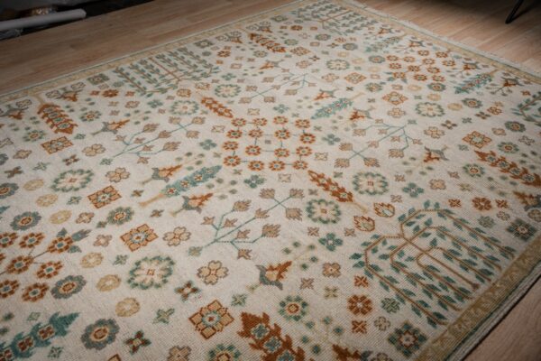 Ivory oushak rug angled allover field detail