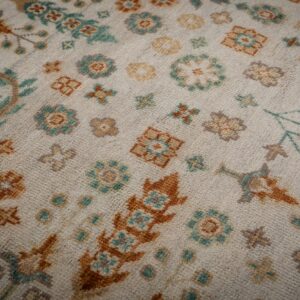 Ivory Oushak rug floral field close-up