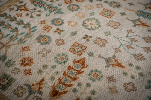 Ivory oushak rug floral field close-up
